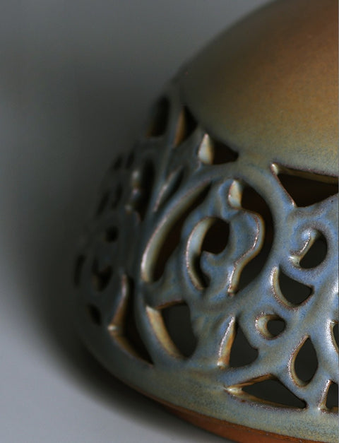 Ceramic incense censer, close-up of pierced lid